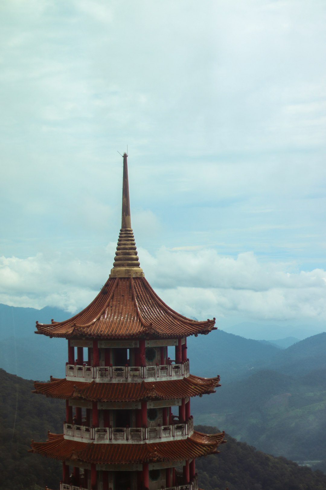 aerial photography of brown pagoda building overlooking mountain range during daytime