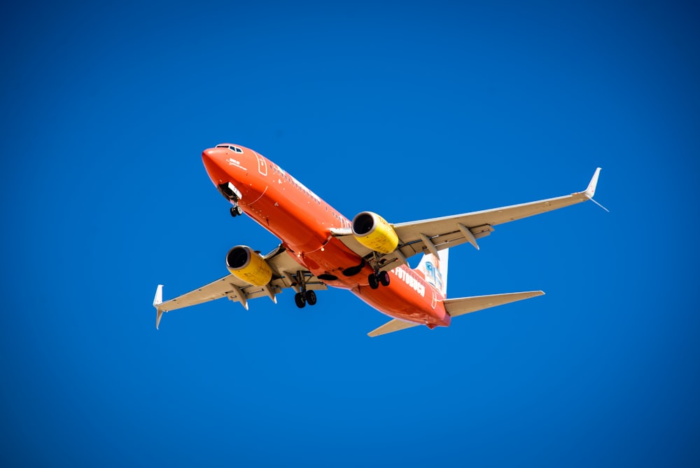 orange and white plane