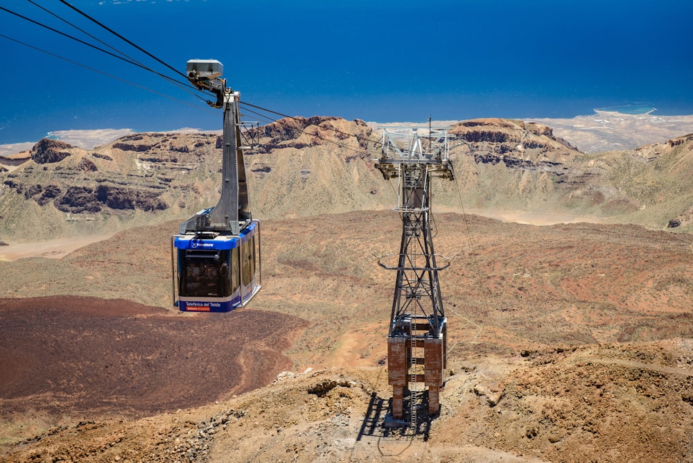 blue cable car during daytime