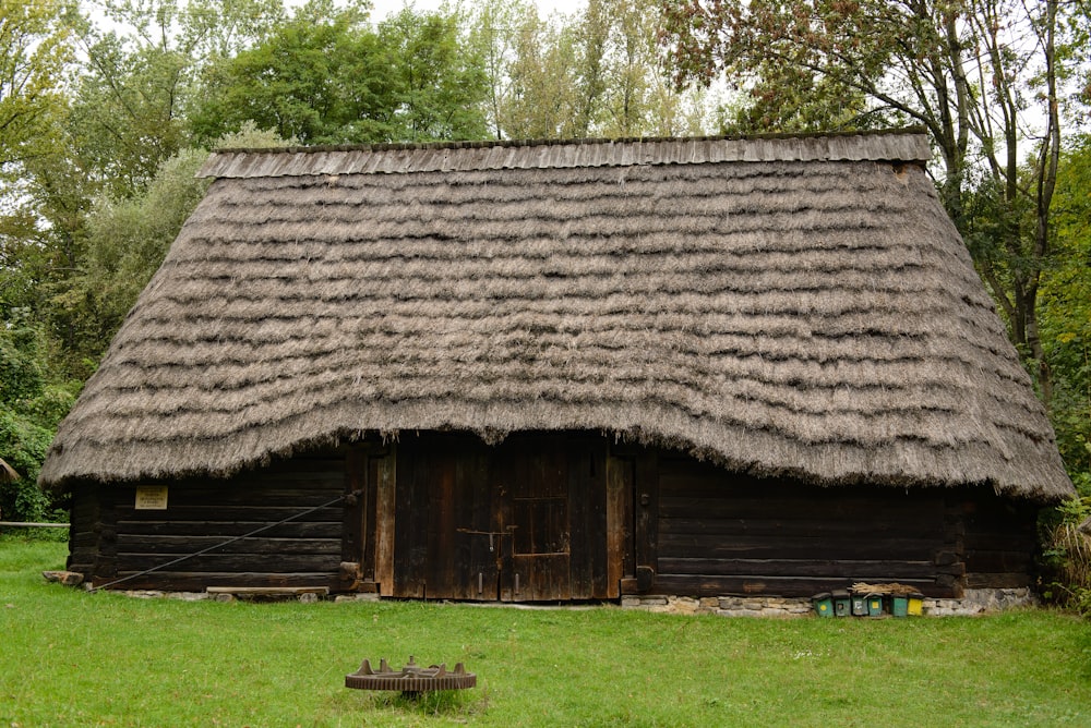 brown hut on grass land