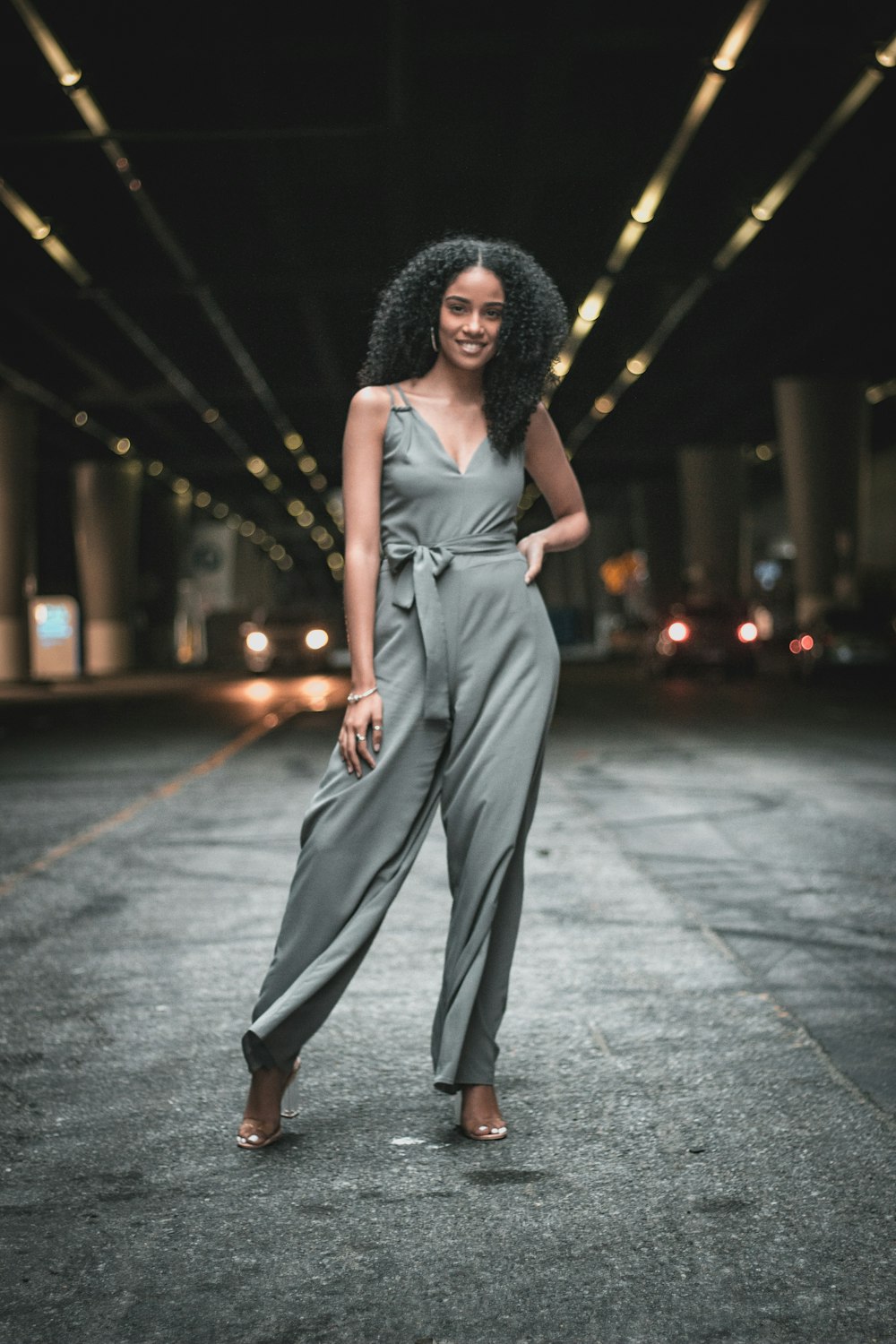 woman standing in the middle of the road