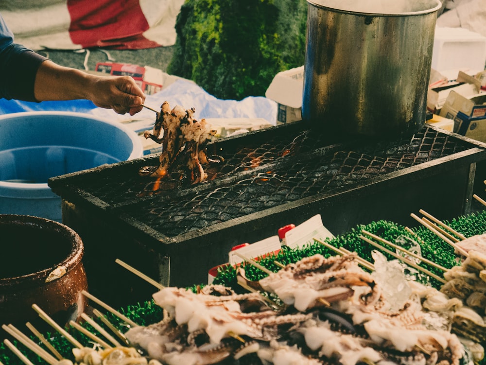 person holding grilled food