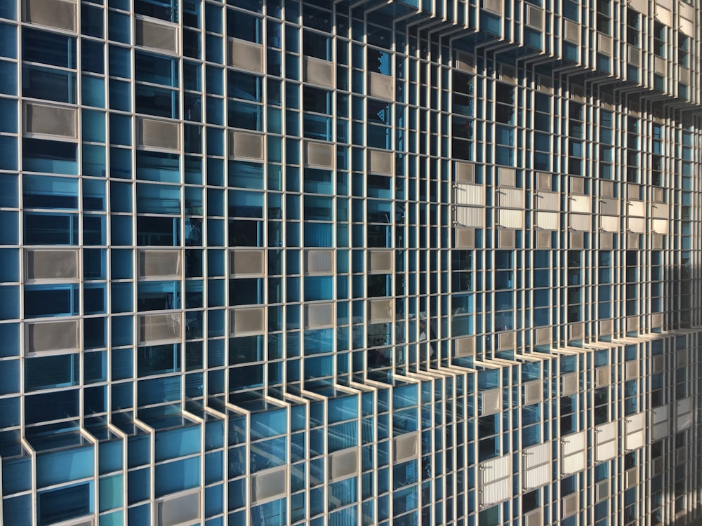 a wall made up of blue and white tiles