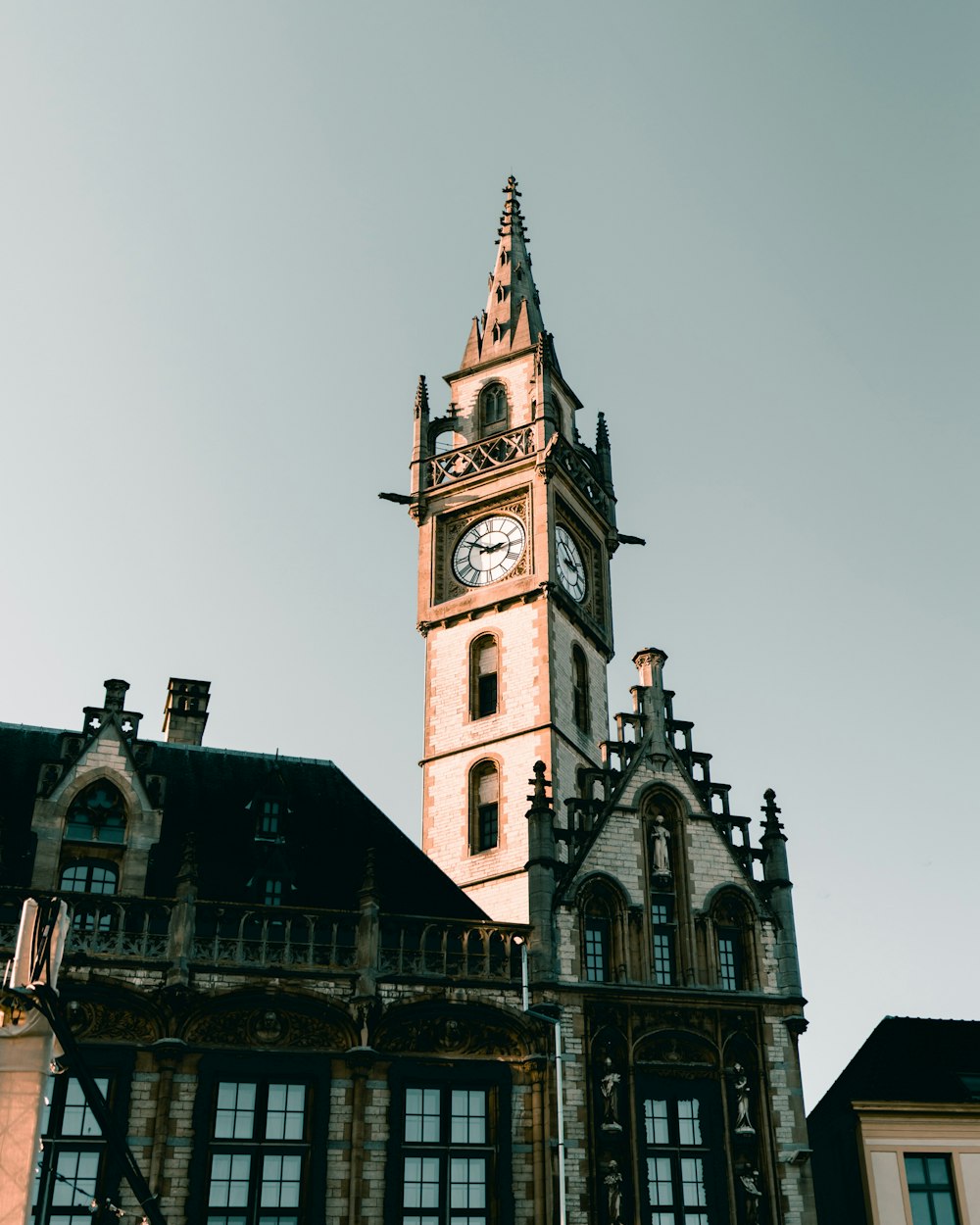 brown clock tower at daytine