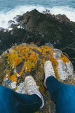 person sitting on rock during daytime