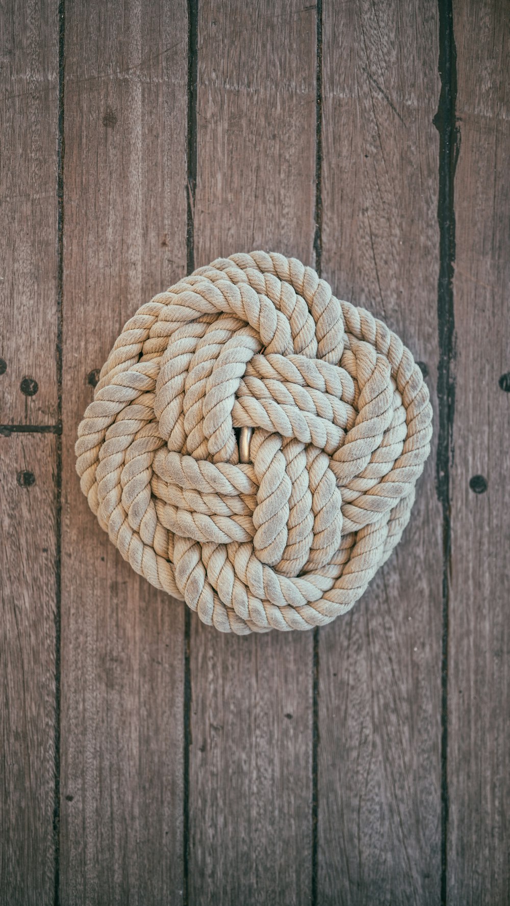 beige rope on brown surface