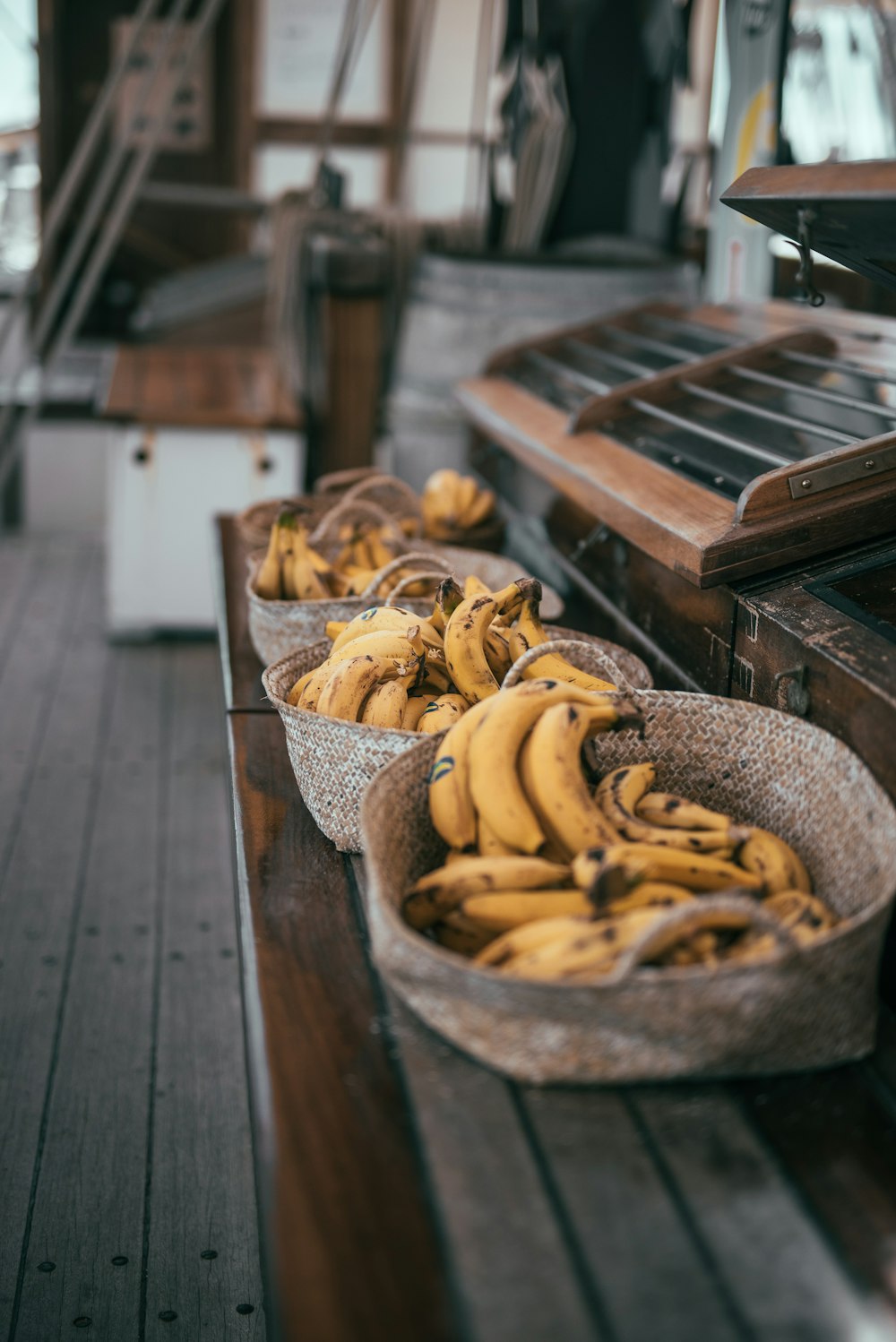 yellow banana fruits in brown basket