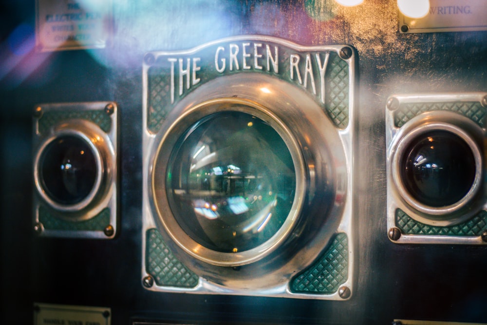 green and brass-colored The Green Ray machine