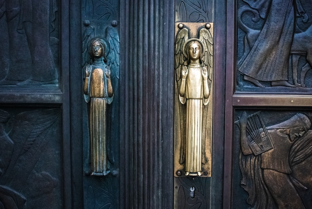 brass angel embedded metal door