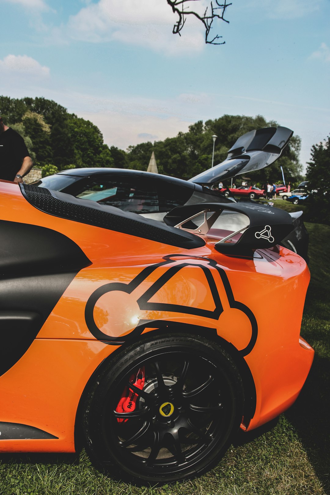 orange and black supercars parked side by side