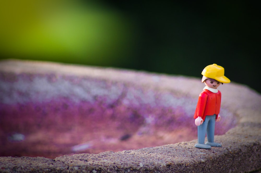 boy wearing cap toy