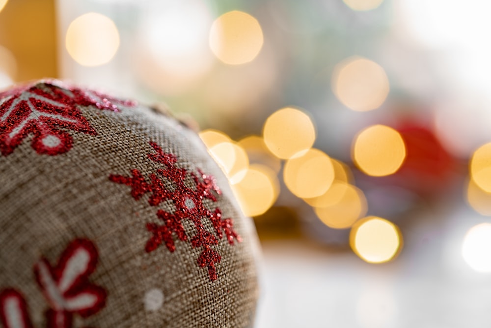 bokeh light photography of brown and red bauble