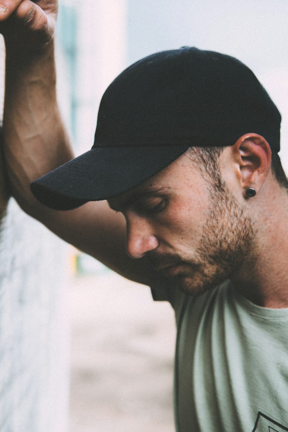 man leaning on the wall