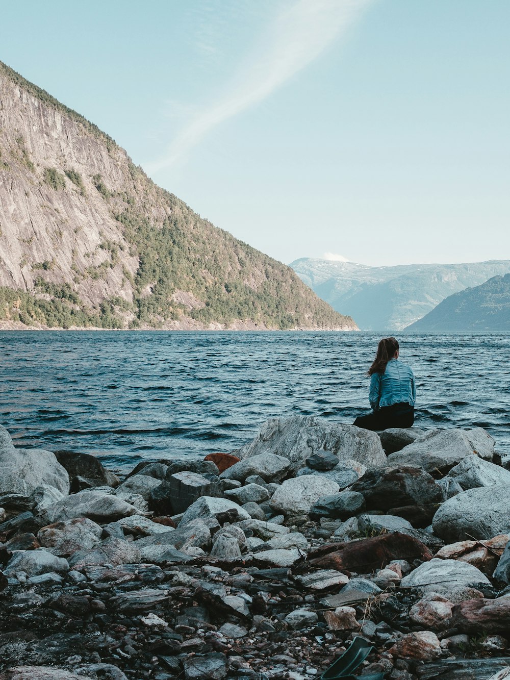 woman sitting on seashore