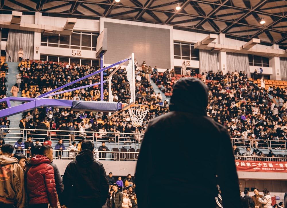 silhoutte of man watching basketball