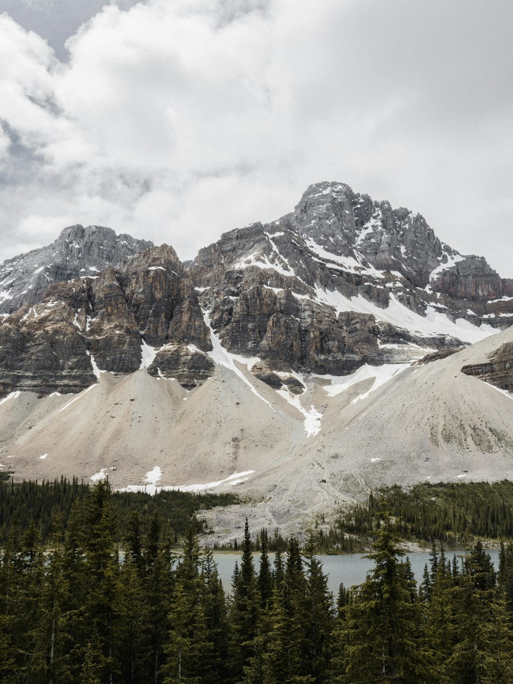 landscape photo of snow covered mountain under cloudy sky