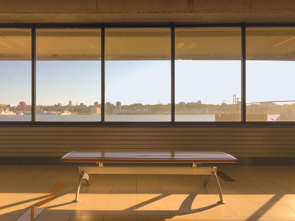 gray steel bench near window