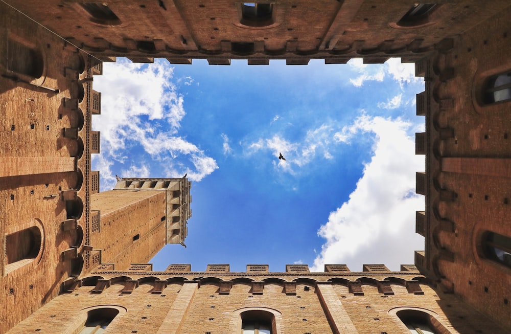 worm view photo of castle under cloudy sky