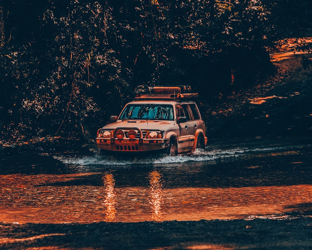 gray vehicle on river