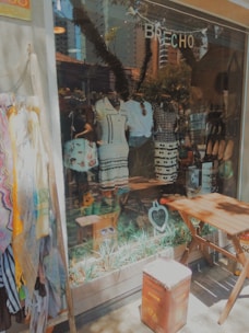 A selection of chic pants and skirts displayed in a cozy store corner.