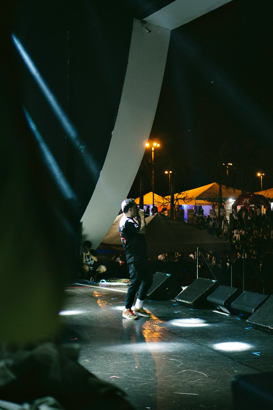 man performing on concert stage