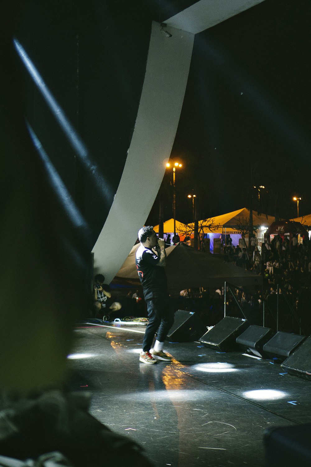 man performing on concert stage