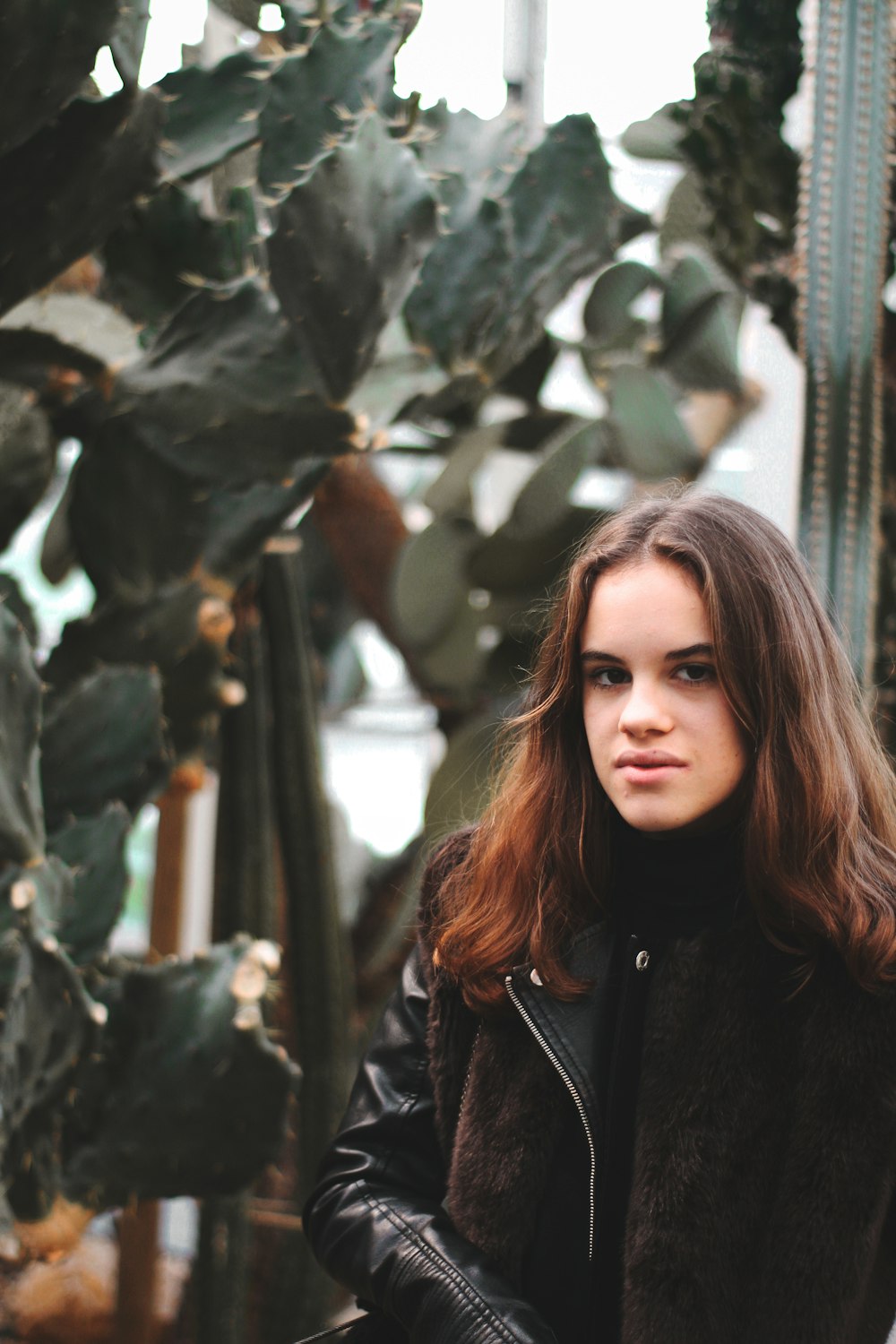 woman wearing black leather jacket