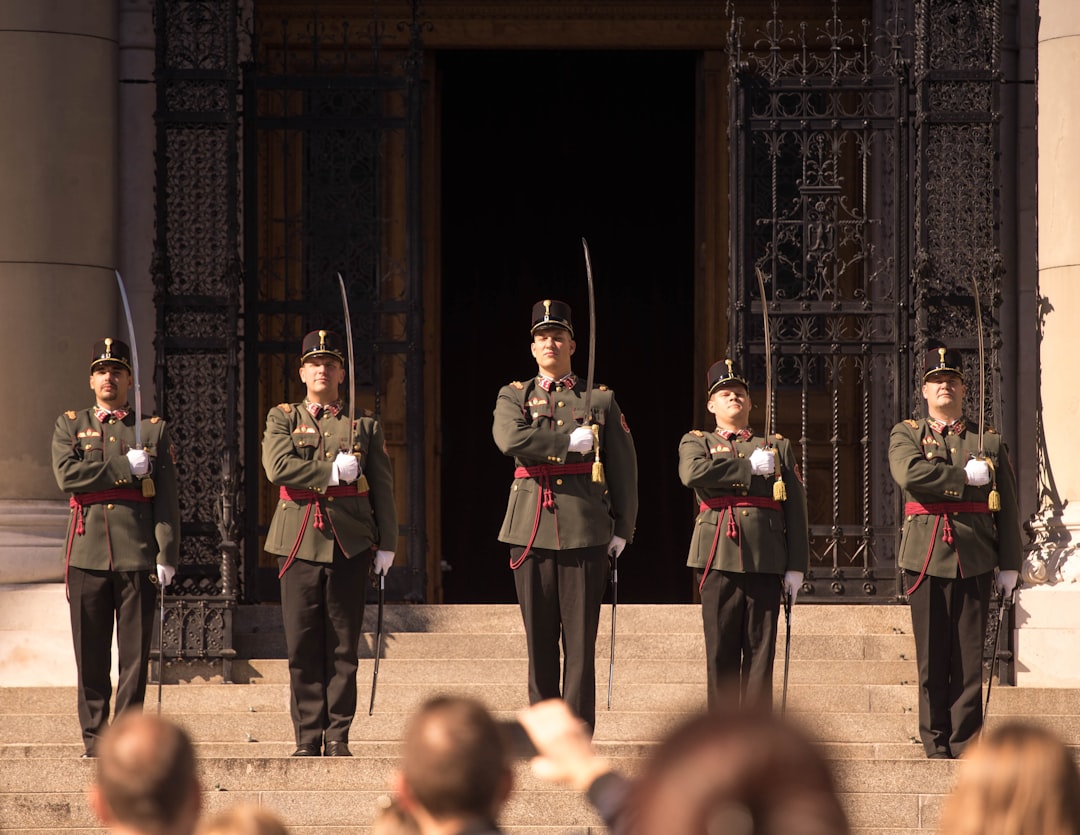 five men holding swords