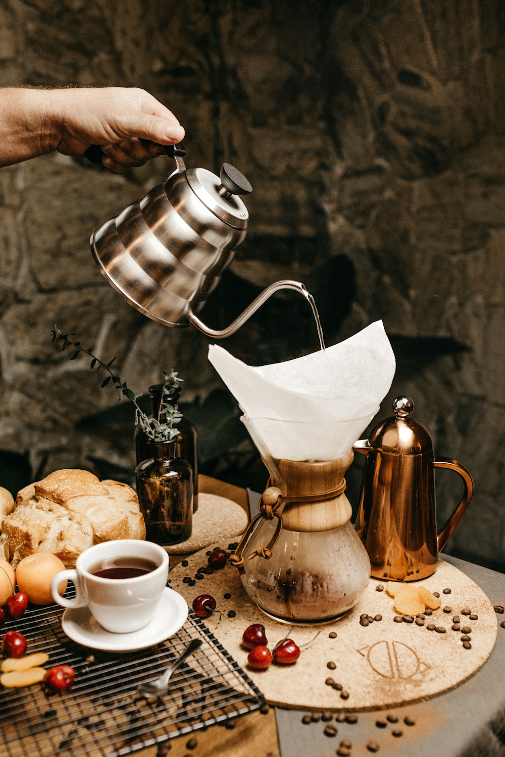 person pouring water on the pot