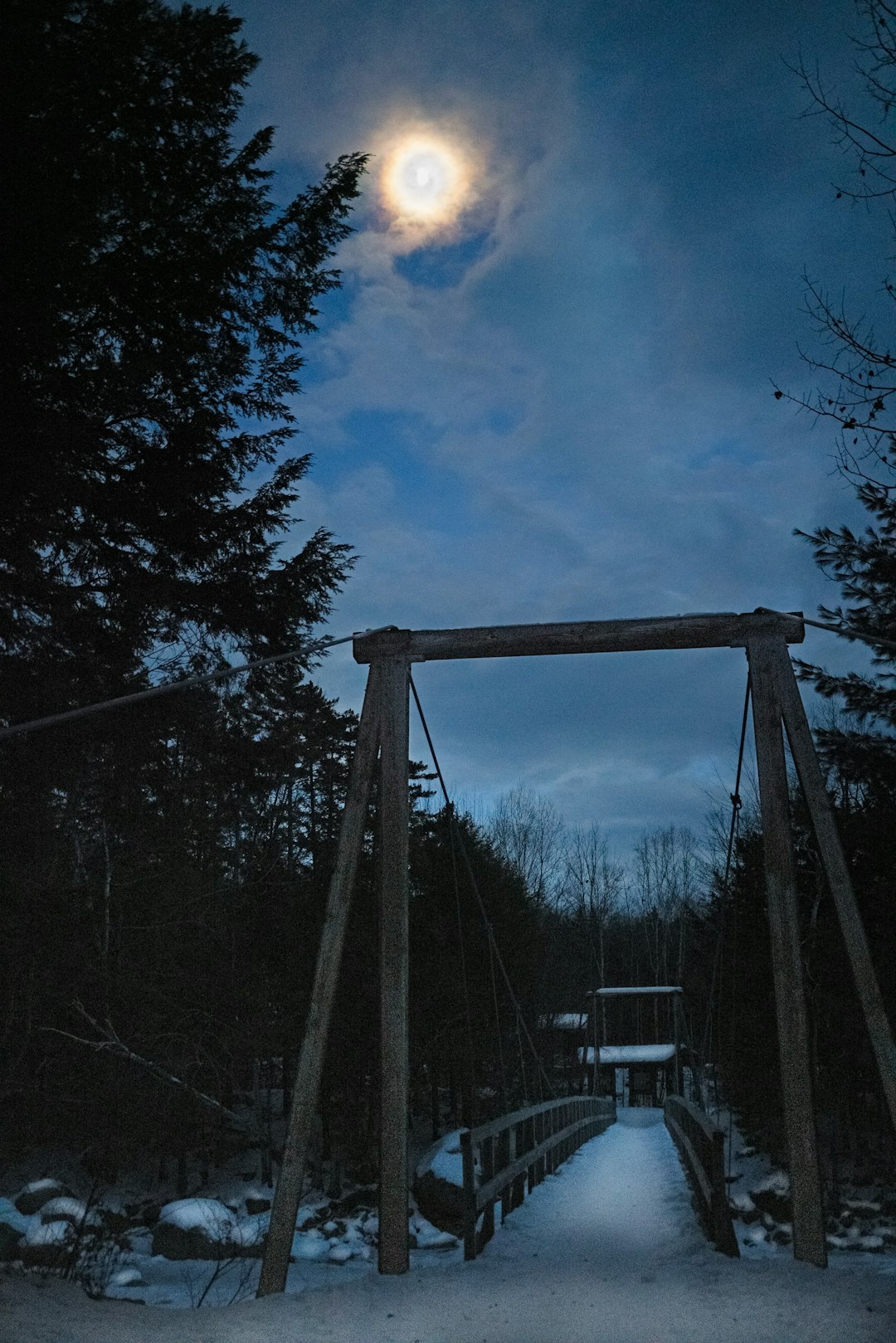 wooden bridge during night