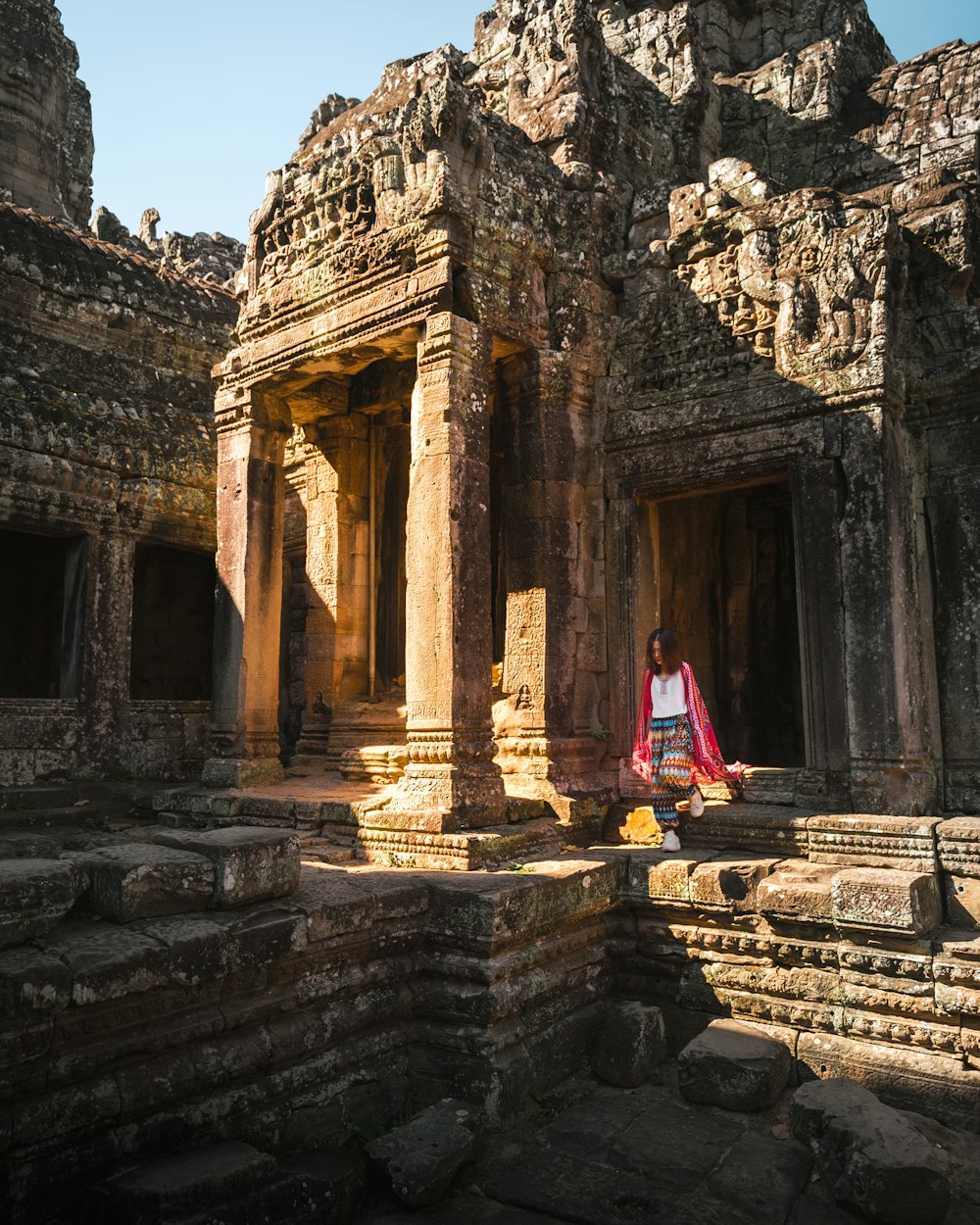 woman standing on concrete ruins