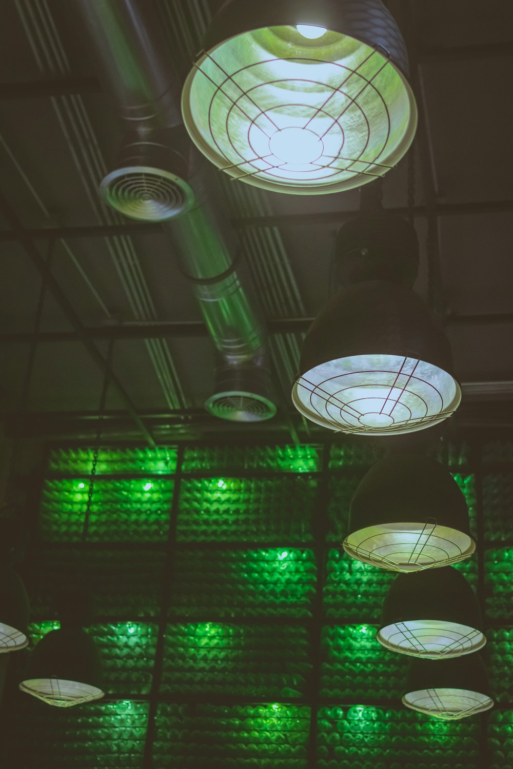 turned on black pendant lamps inside room