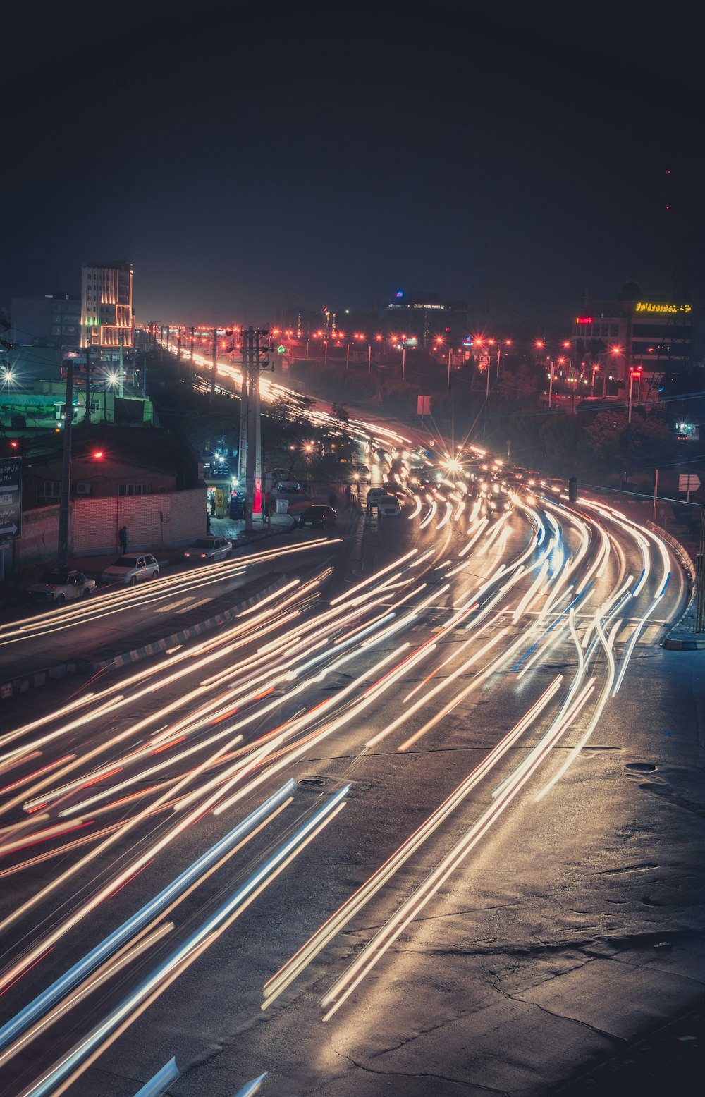 time lapse photography of vehicles passing during night time