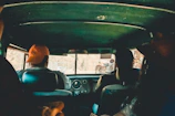 People sharing a ride in a car, illustrating carpooling.