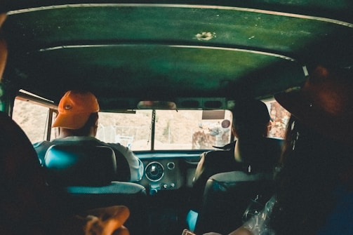 Multiple riders sharing a comfortable car ride together.