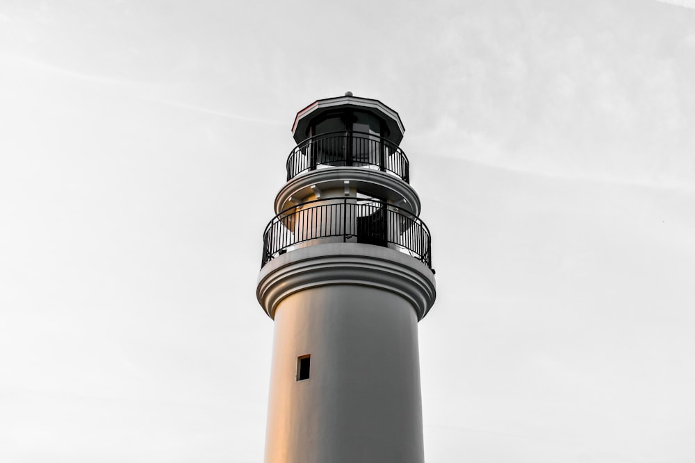 close-up photo of gray concrete lighthouse tower