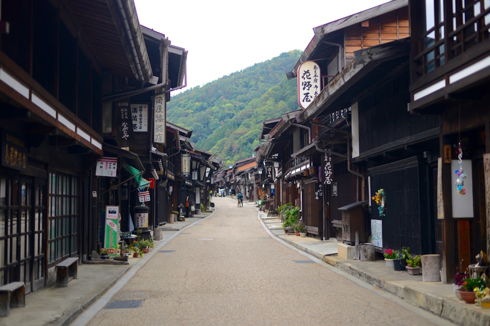 person between houses during daytime