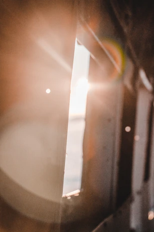An artistic frame showing light flares and shadows playing across a film set.