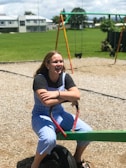 woman sitting on see saw