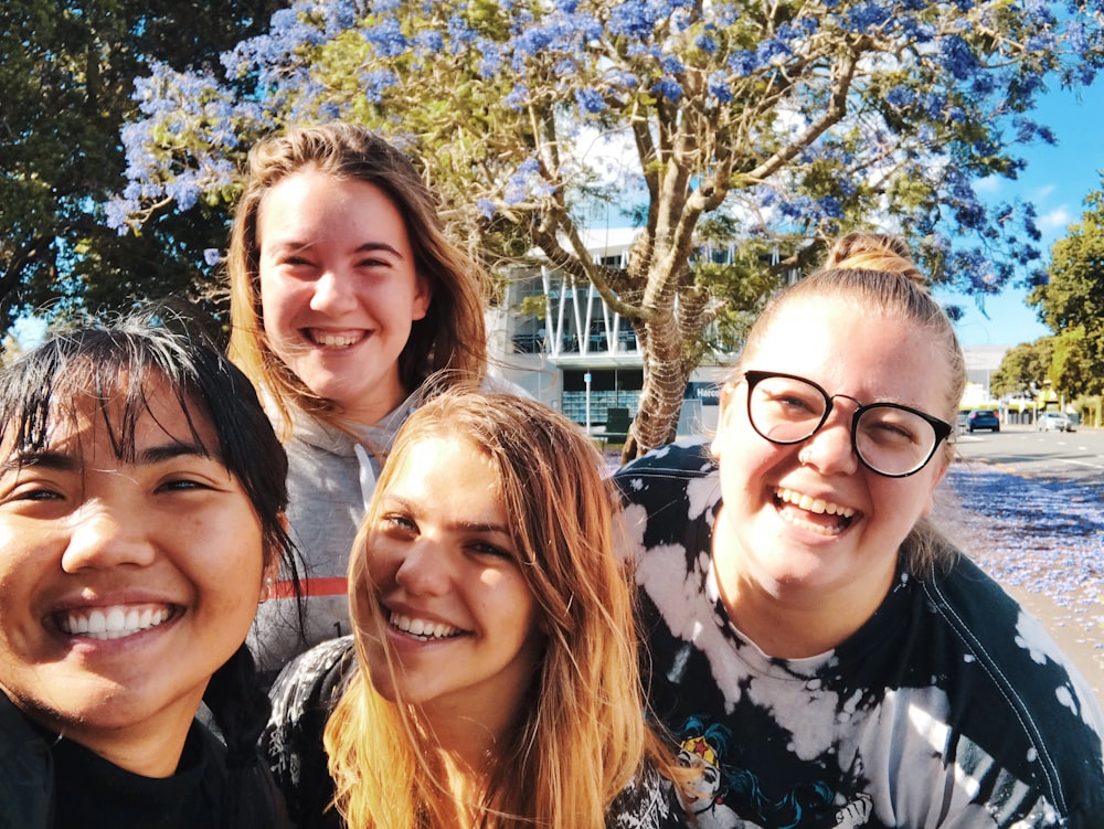 four girl smiling outdoor