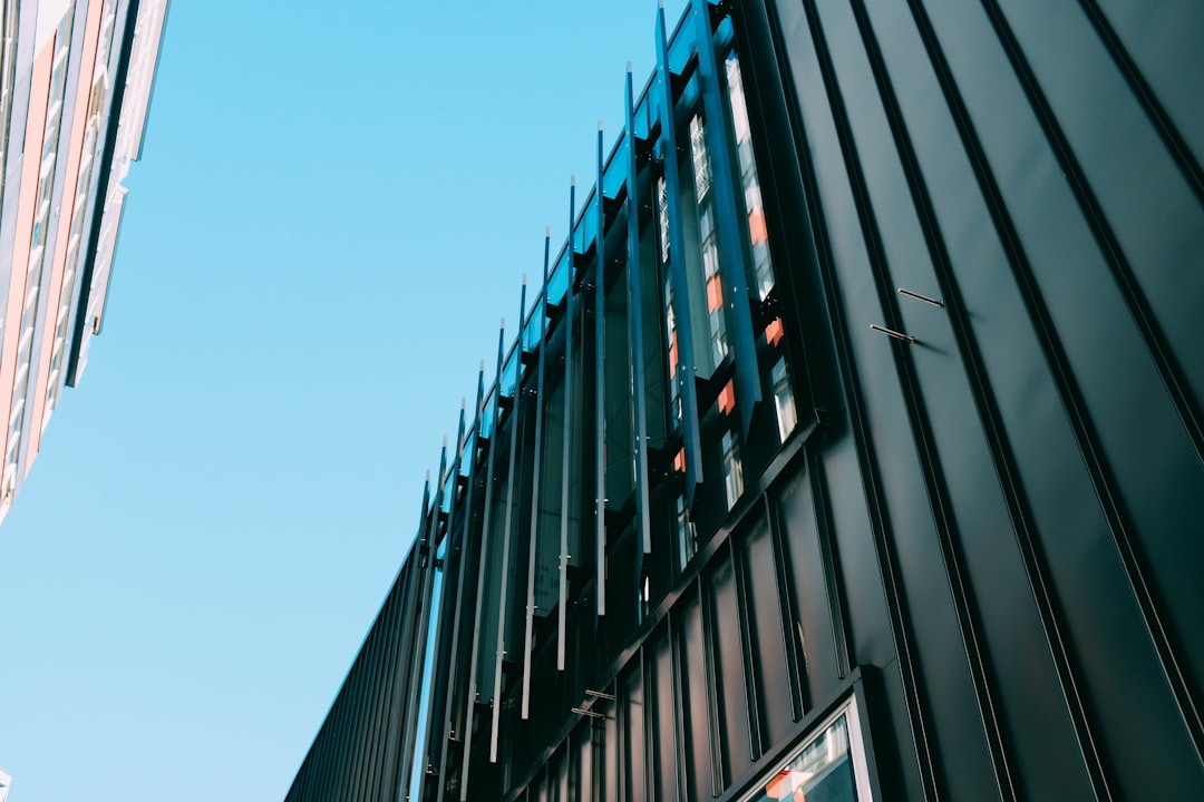 low-angle photography of black building at daytime