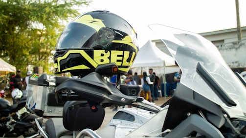 A volunteer handing out motorcycle safety brochures at a local event.