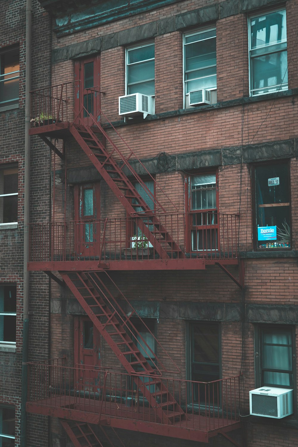 brown bricked building with staircase