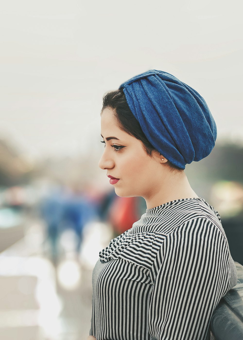 woman wearing blue headdress