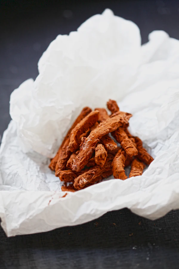 Dehydrated chicken jerky strips in butcher paper