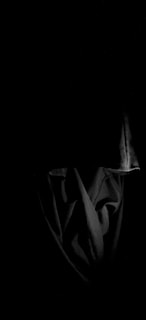 A hauntingly beautiful image depicting a dark romance scene.