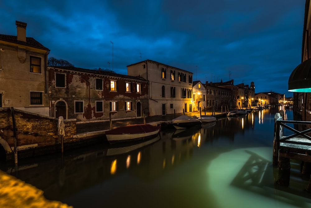 boats at dock during nighttime