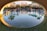 Sunlit view of Casa Luzia’s sparkling saltwater pool surrounded by desert plants.