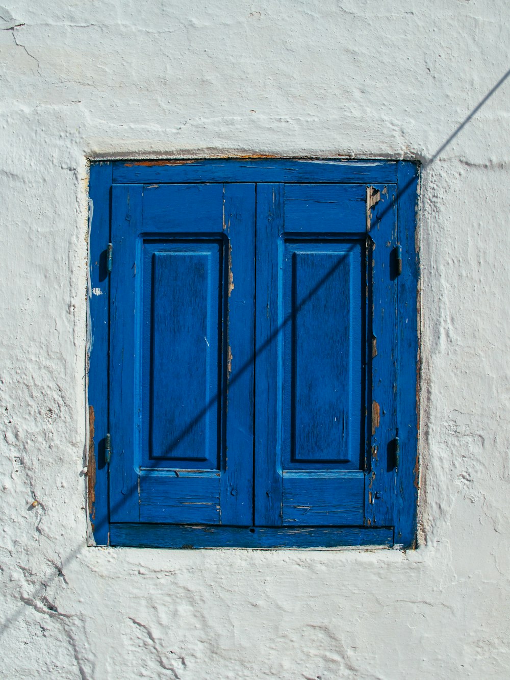 blue wooden window grille