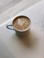 Lifestyle shot of a sophisticated coffee lover enjoying a cup in a minimalist setting